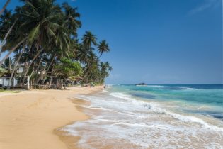 Hikkaduwa,,Sri,Lanka.,Unidentified,People,On,The,Beach,At,Hikkaduwa.